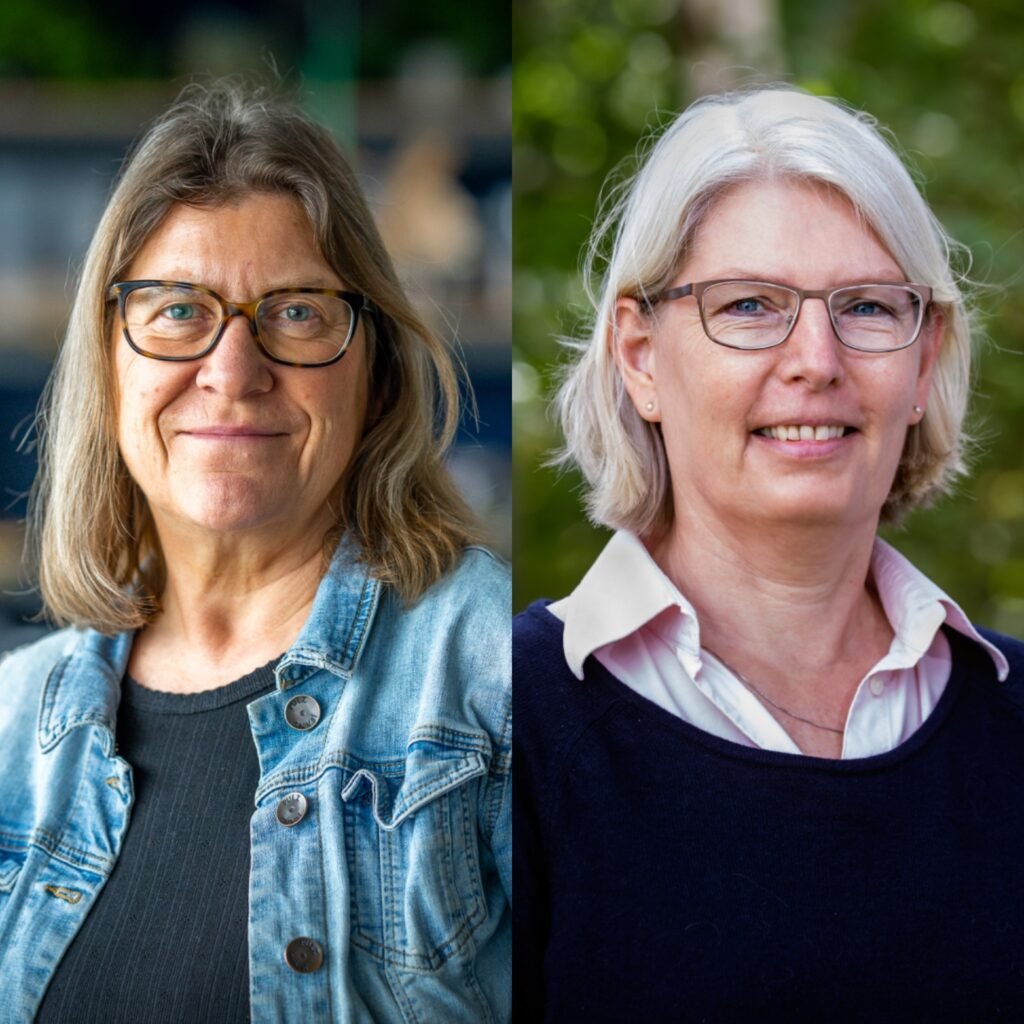 A picture of Hanne and Hanne. Both are looking at the camera and smiling. Both are wearing glasses.